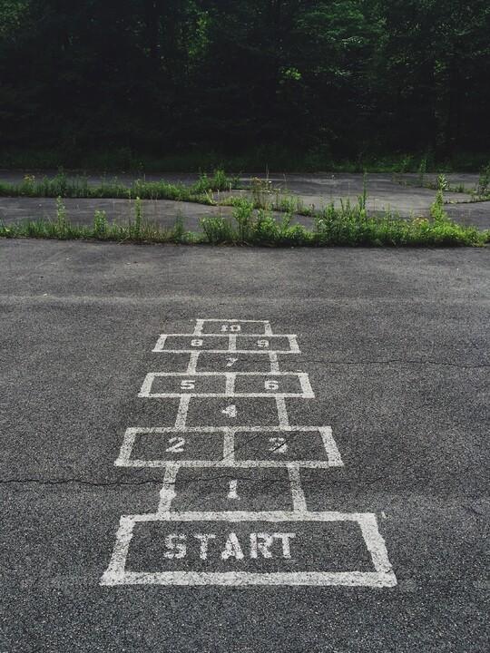 Hopscotch grid drawn with chalk on blacktop