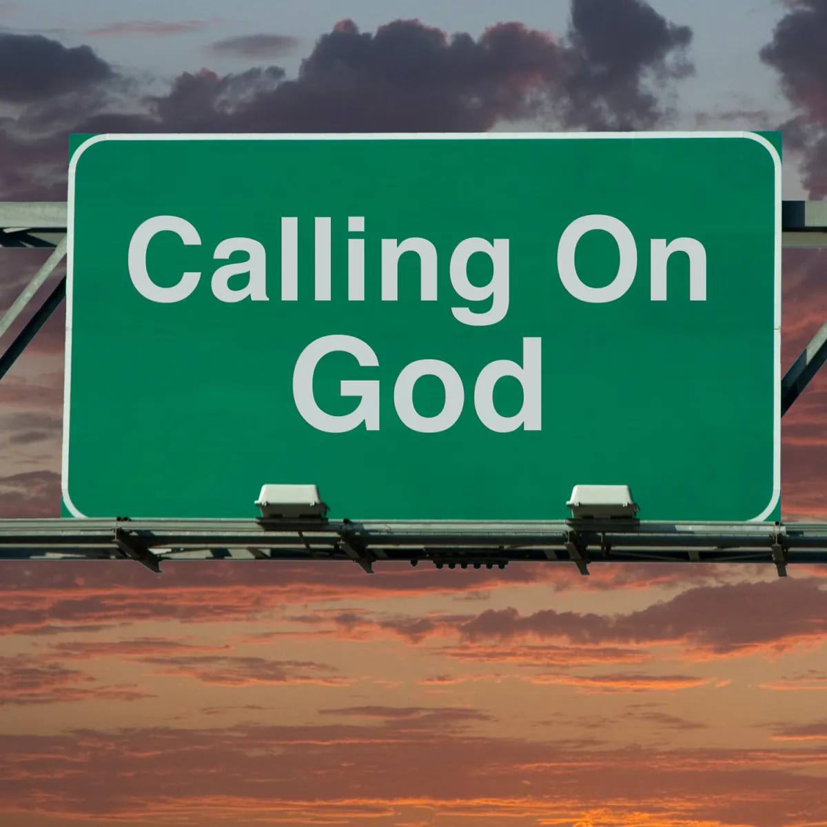 A large green highway sign with the words "Calling On God" in bold white letters. The sign is set against a dramatic sunset sky with dark clouds and vibrant hues of orange and pink, creating a striking and contemplative visual contrast.