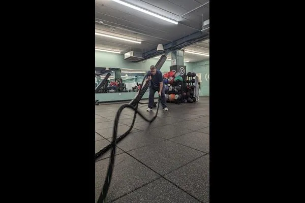 Dan working the battle rope to get stronger and slow the aging process