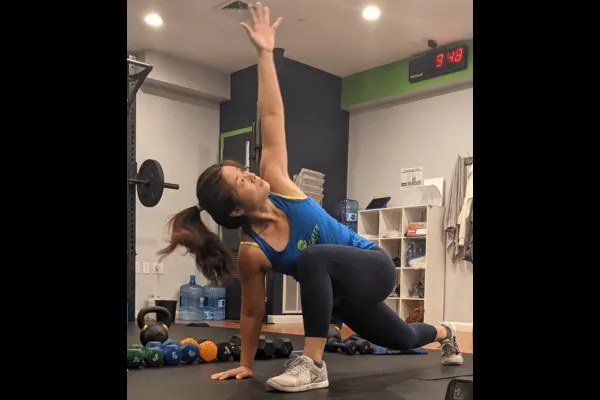 Wing works on her hip and t-spine mobility