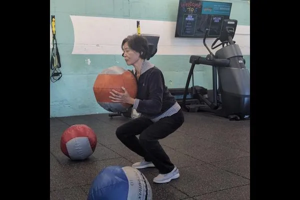 Med-ball squats are one way that Alice keeps Father Time at bay.