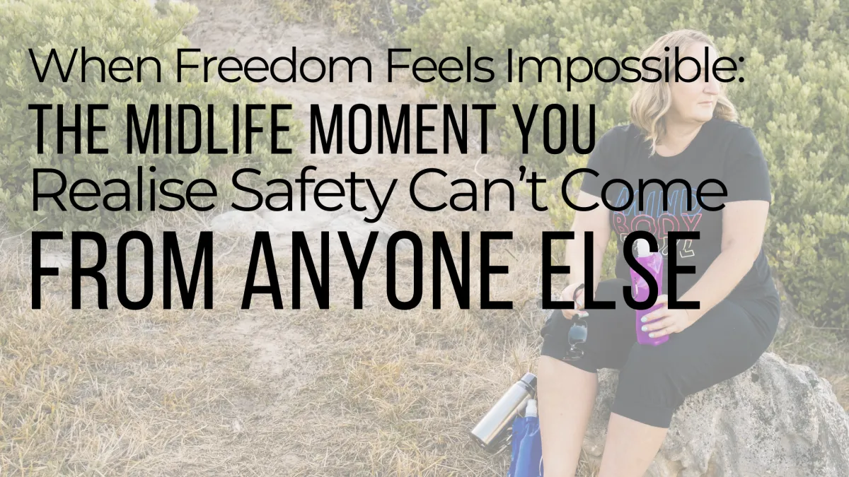 Midlife woman sitting outdoors looking reflective, symbolising the emotional weight of feeling unsafe and the journey toward rebuilding internal safety in midlife.