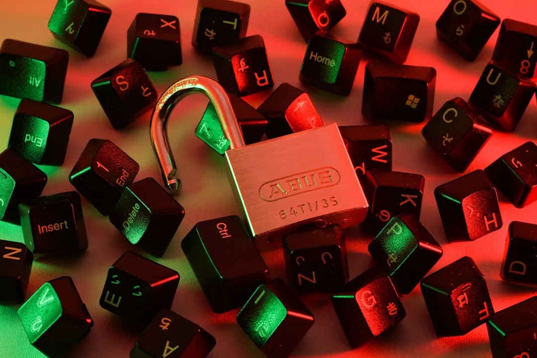 A lock with the shackle open, surrounded by scattered keyboard keys illuminated in red and green light, symbolizing the concepts of data security and privacy in the context of AI and new digital tools.