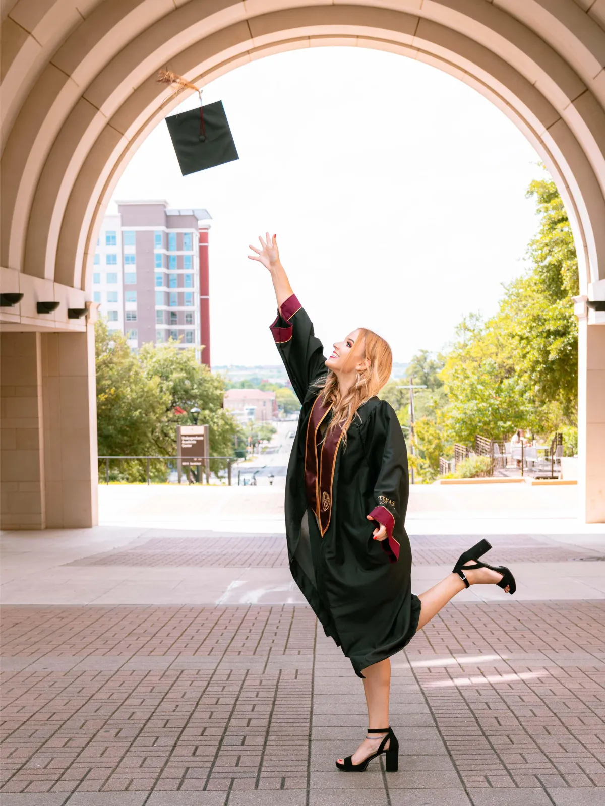 Texas State University graduation portrait, highlighting the graduate's accomplishment.