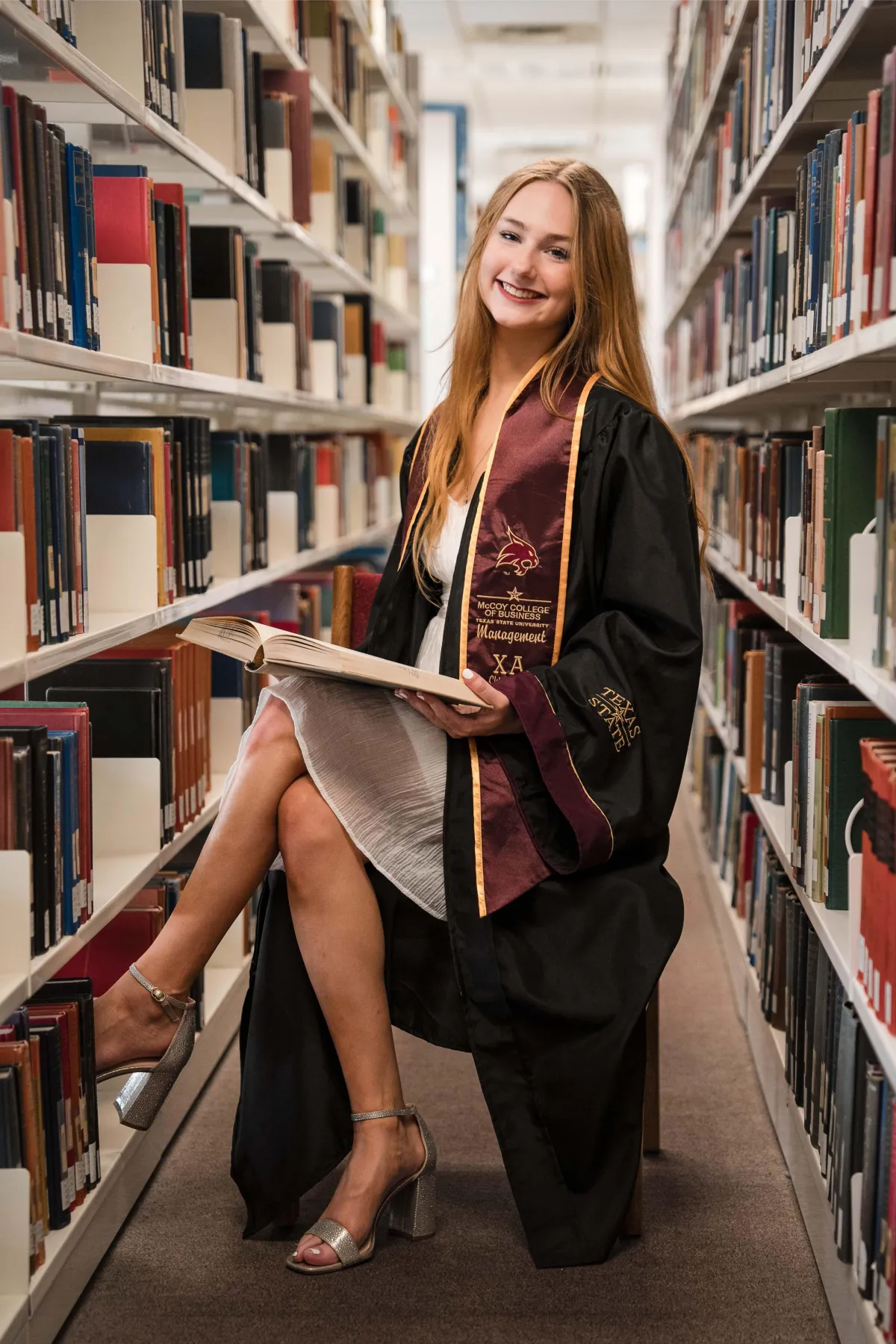 A Texas State University graduate's portrait, marking the completion of their studies.
