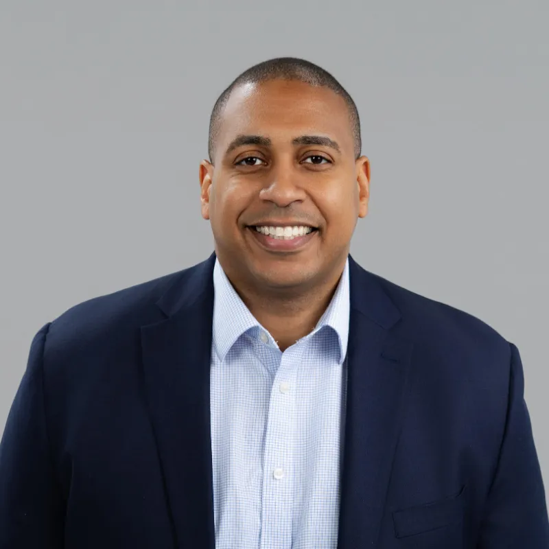 Professional headshot of Ben Shephard, former Executive Director and Co-Head of CIBC Innovation Banking’s New York Office, smiling confidently in business attire.