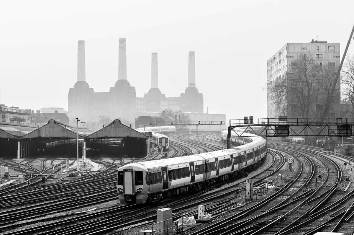 black and white photo of a train in battersea, london