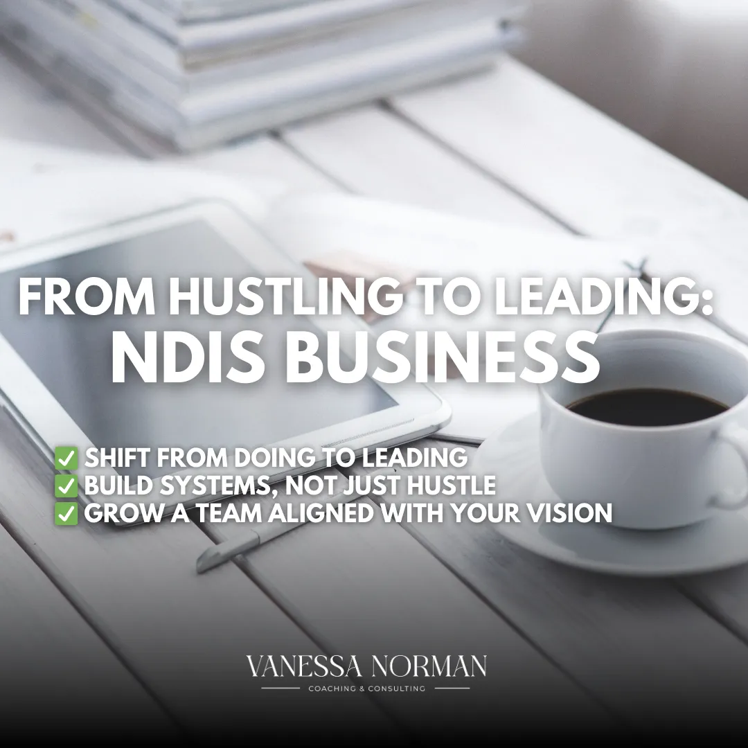 A professional flat-lay workspace featuring a tablet, coffee cup, and notebook on a white desk. Bold text overlay reads 'From Hustling to Leading: NDIS Business' with three key points: 'Shift from Doing to Leading', 'Build Systems, Not Just Hustle', and 'Grow a Team Aligned with Your Vision'. Branding at the bottom shows 'Vanessa Norman Coaching & Consulting'