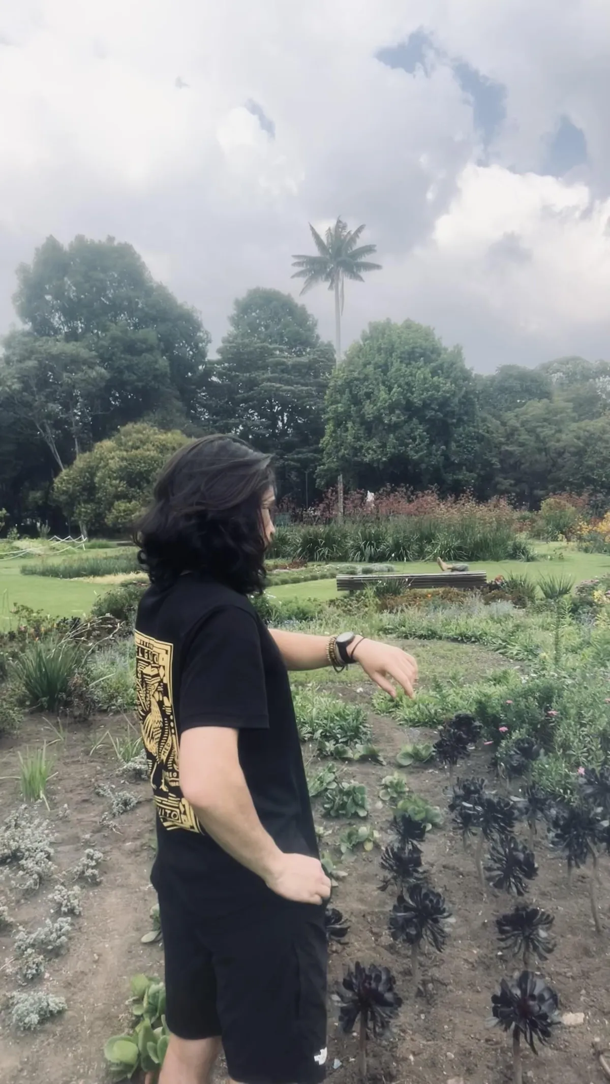 A man holding his phone with a voidless stare.