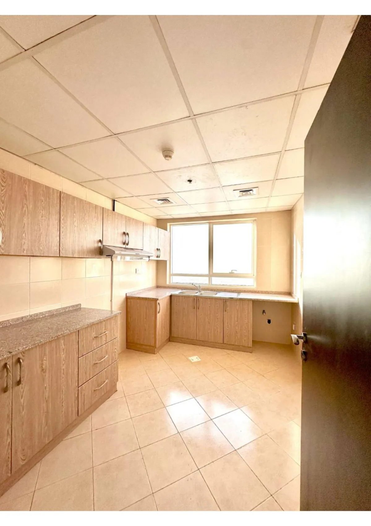 Kitchen photo towards the window for 2 bedroom apt in Khawla Tower