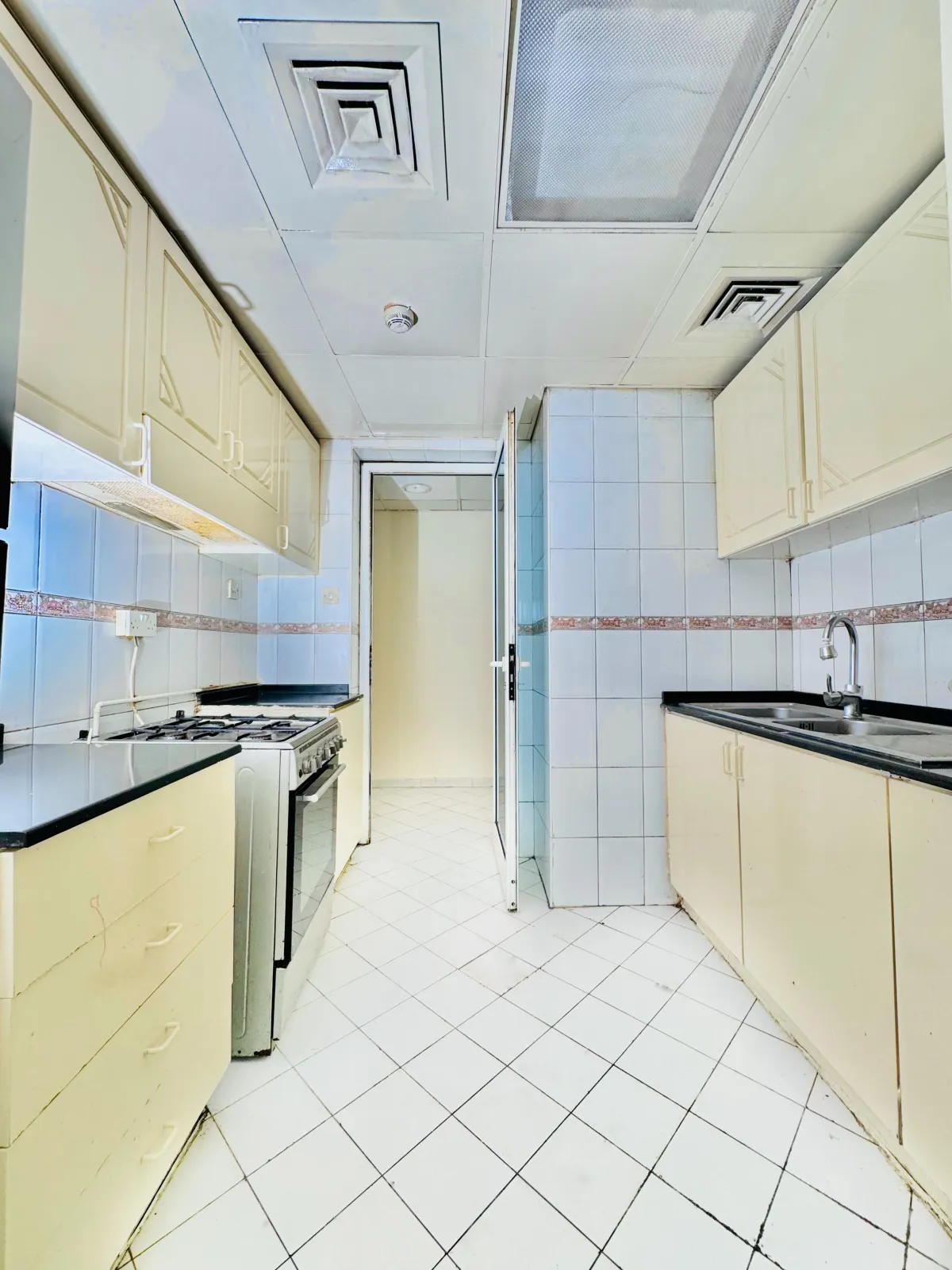 An image of the kitchen in the 1 bedroom apt in Al Mubarak Center