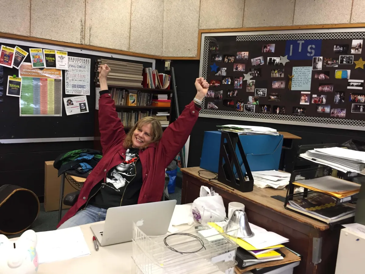drama teacher rejoicing in her classroom