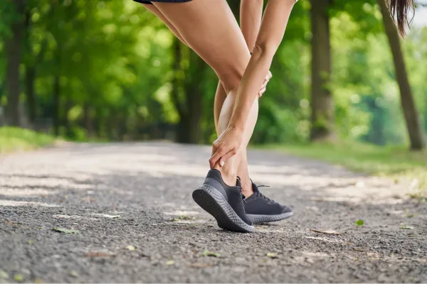 man with pain in achillies tendonitis