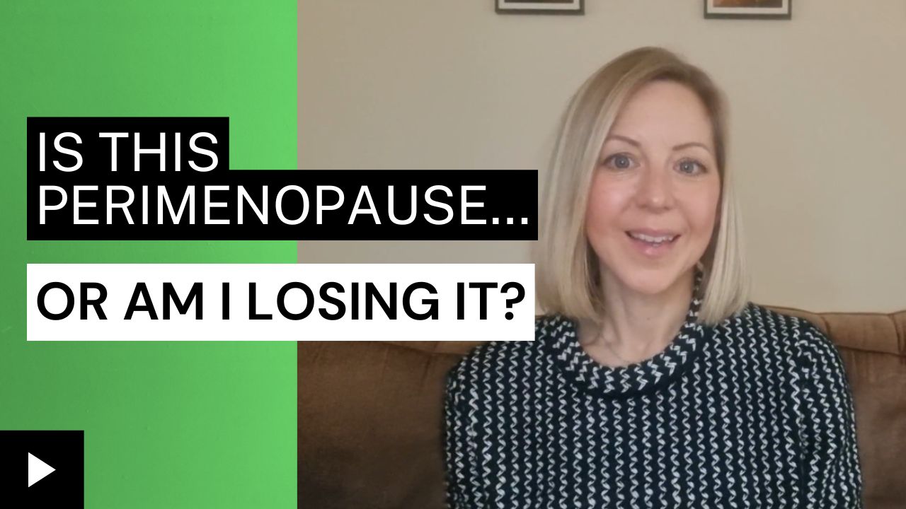Woman in her 40s looking thoughtful while sitting in bed at night, representing early signs of perimenopause like anxiety, insomnia, and mood changes.