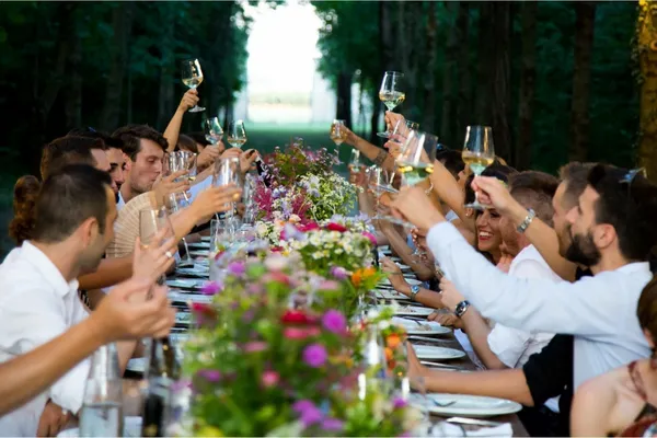 wedding guests celebrating the newly wed couple