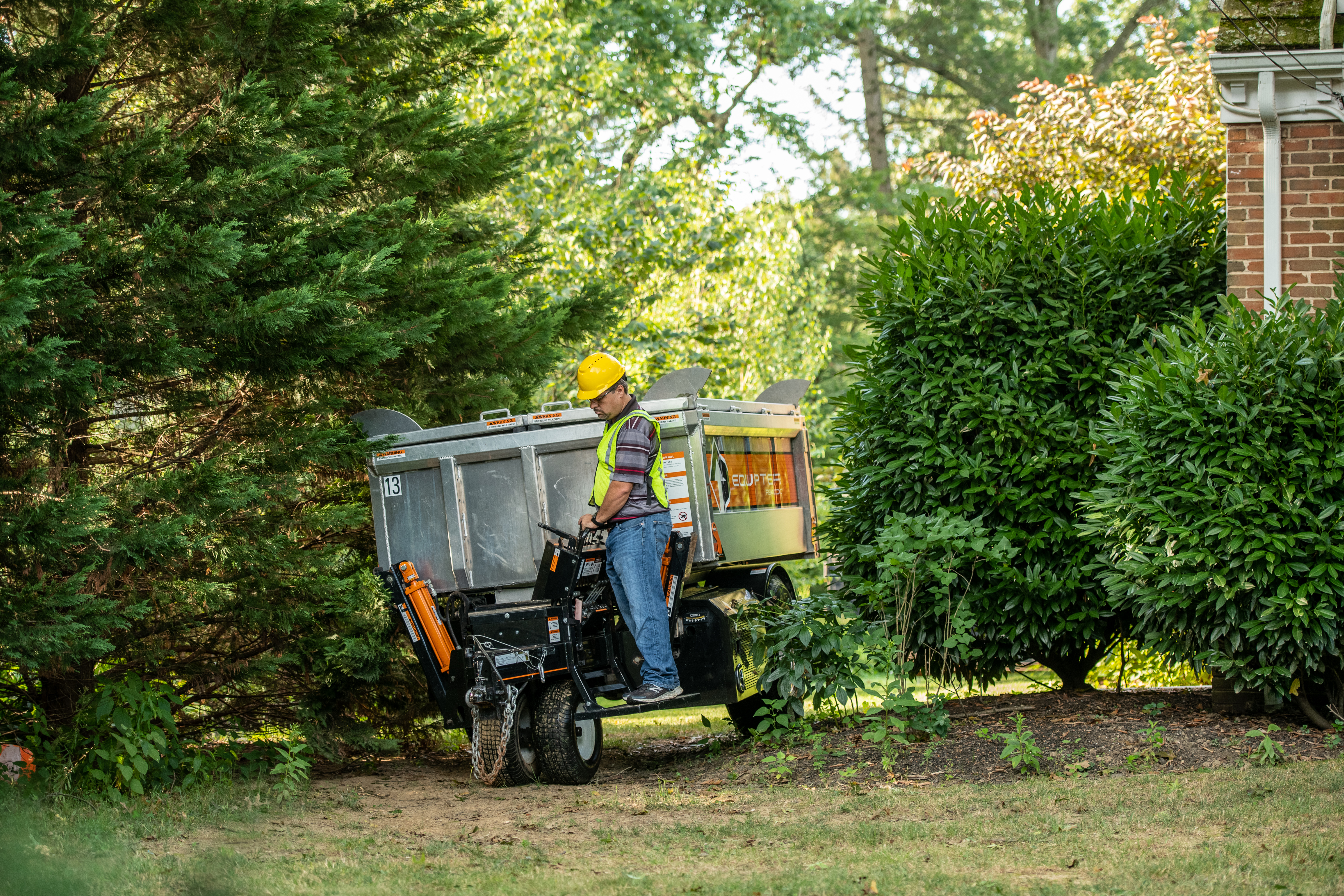 Equipter Passing Through Tight Landscaping