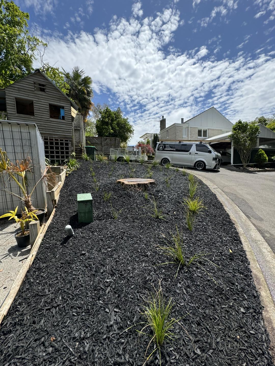 Landscaped front yard with new planting and black mulch, representing landscaping services in Hastings, Hawke's Bay by Mitch's Maintenance
