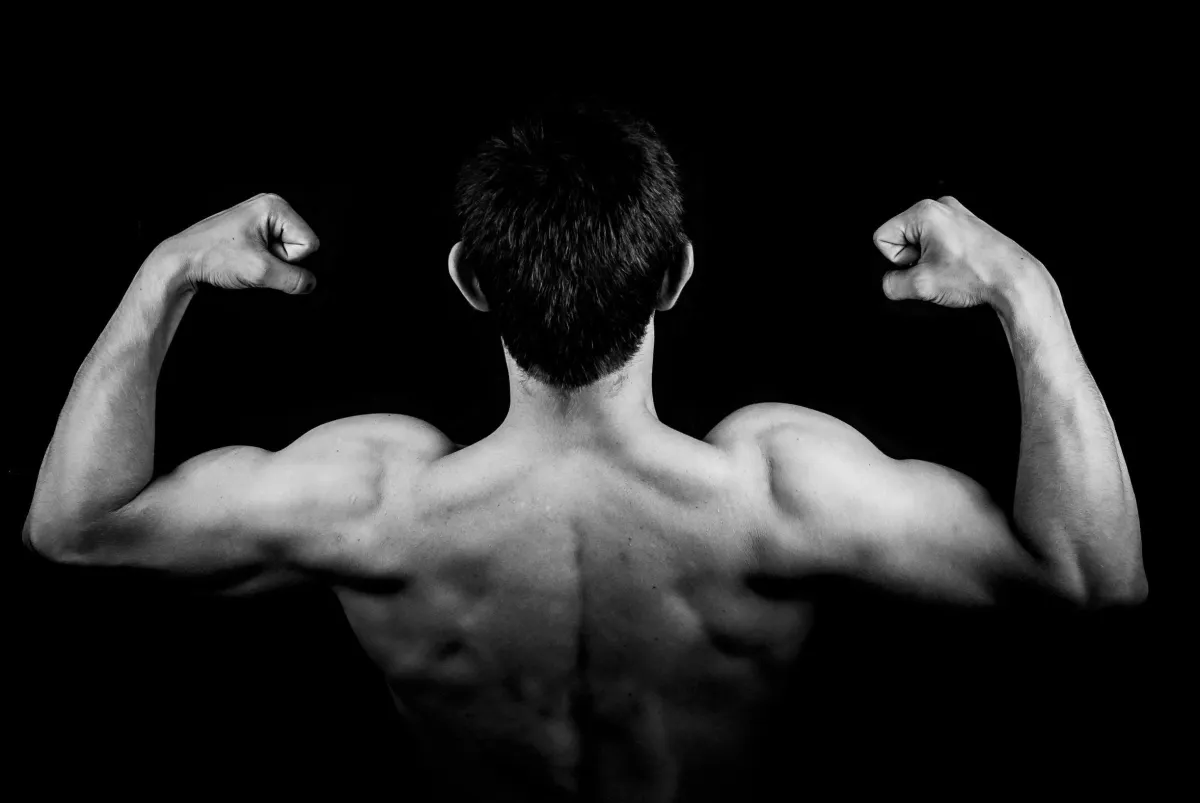 black and white image of man's muscles