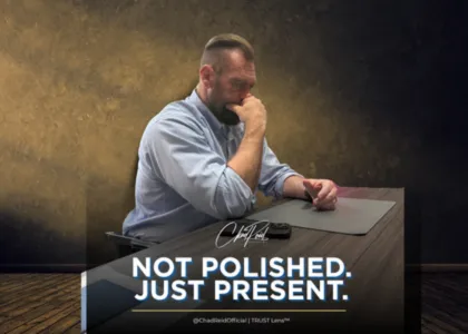 Chad Reid seated in reflection with text overlay: Not polished. Just present.