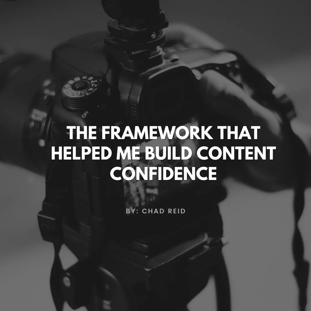Close-up of a person holding a professional camera with the text 'The Framework That Helped Me Build Content Confidence by Chad Reid' overlaid on the image.