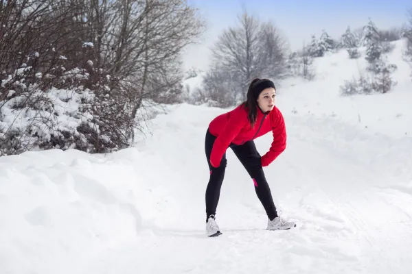 women out of breat in the snow