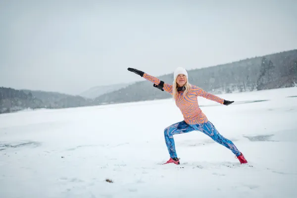 women stretching in the snow