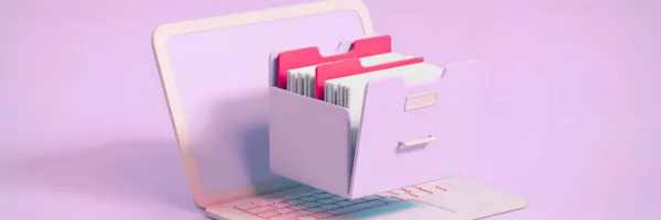 An image of a laptop with an open filing cabinet draw above the keyboard.