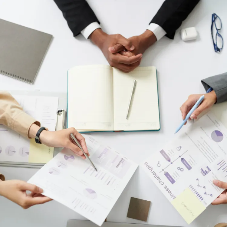 hands displaying marketing papers