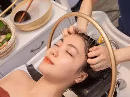Gentle scalp massage during Nourishing Head Spa treatment