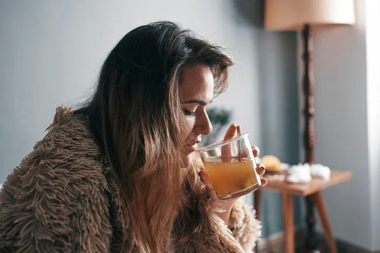 sick person drinking juice