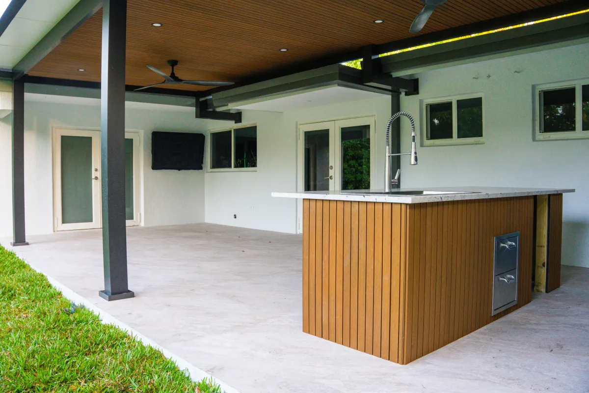 Modern pergola with louvered roof in South Florida backyard
