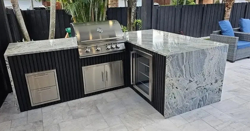 Custom outdoor kitchen with grill and stone countertops in Miami