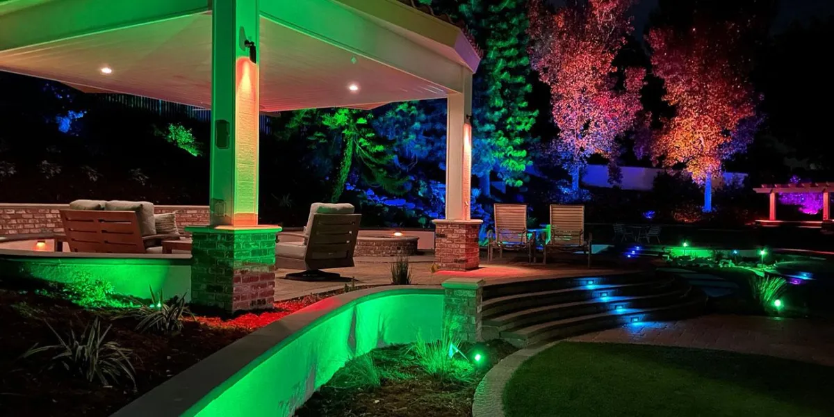 A Garden Paradise comes to life, bathed in splashes of color. The Pavillion, glowing green, stands out against the backdrop of black, accented by dashes of red and blue.