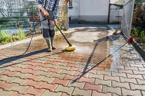 What’s That Black Stuff on Your Driveway? Learn How to Clean It Safely 
