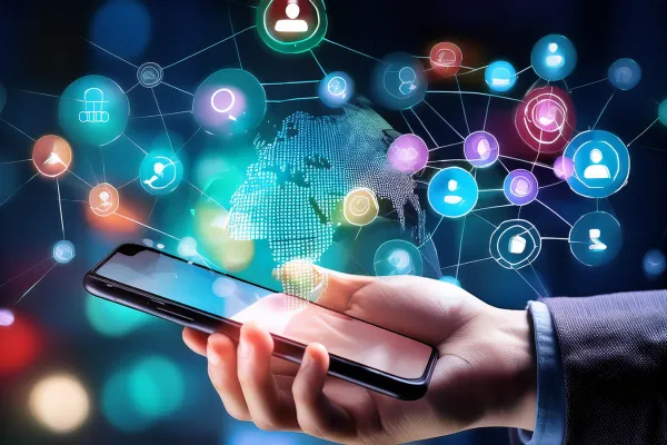 A person holding a smartphone with digital marketing icons, global network graphics, and connected data nodes representing online advertising, paid media campaigns, and digital connectivity.