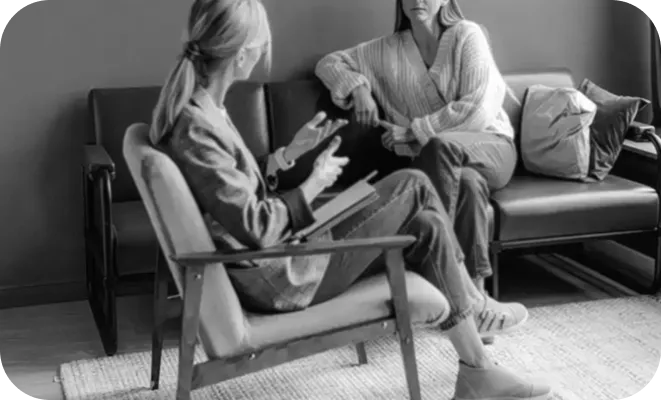 Two women sit in a serene room in what is a first counselling session. Private counselling falmouth