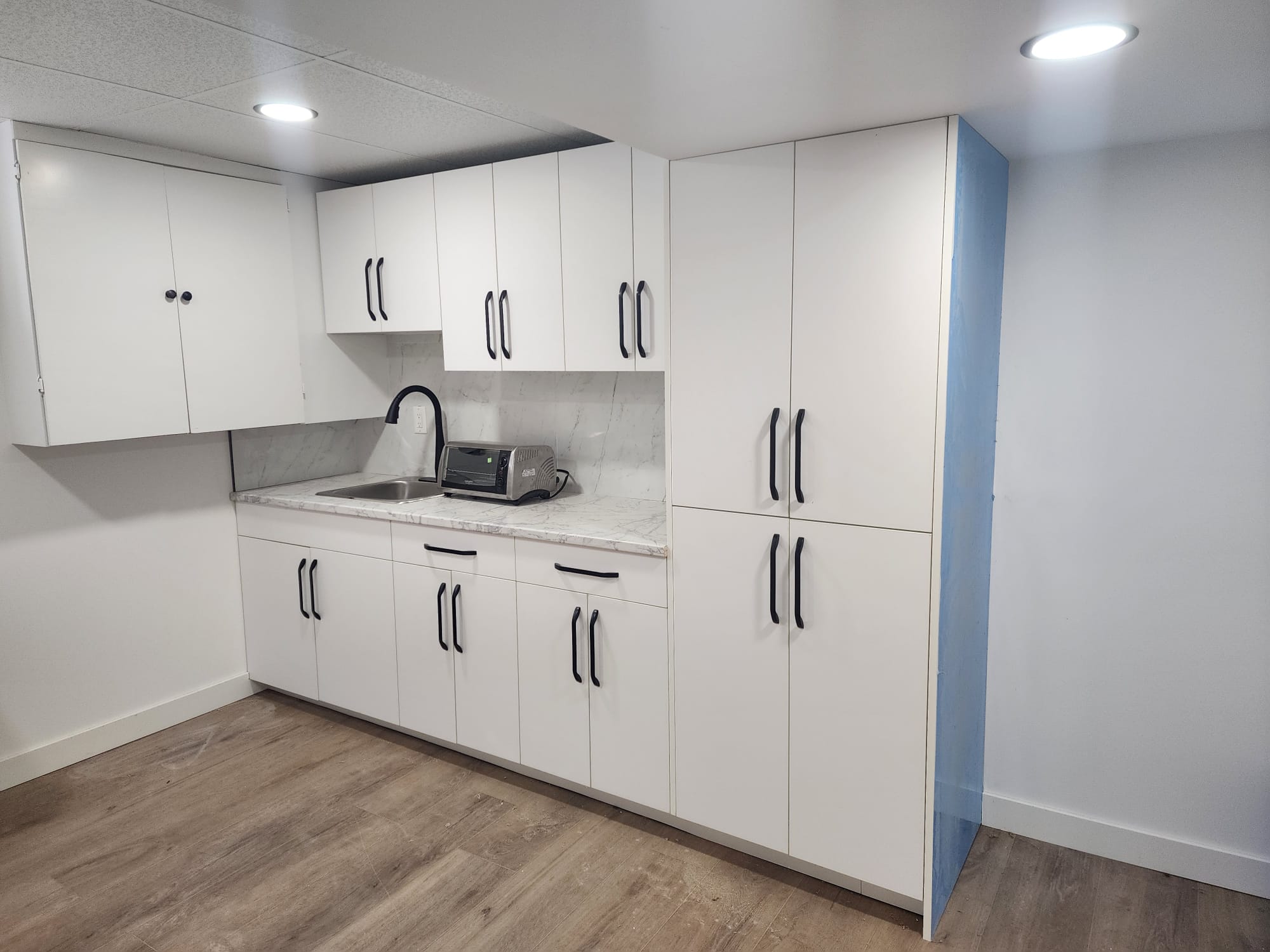 Wet bar with storage in basement