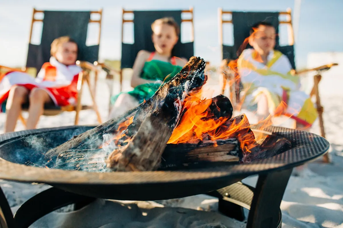 Kids enjoying a beach bonfire on 30A