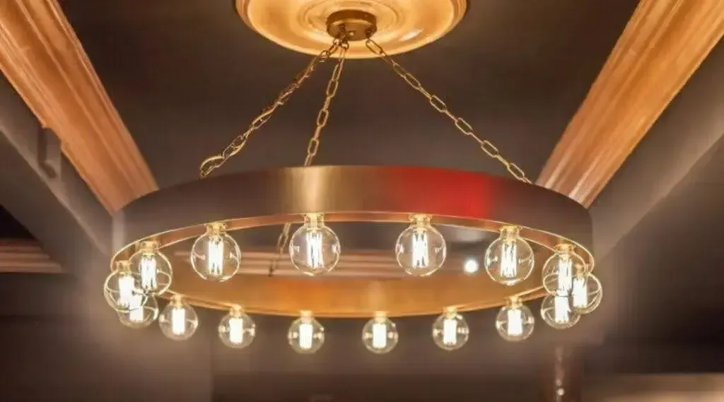Stylish circular chandelier with a glowing light fixture, adding charm to the space.