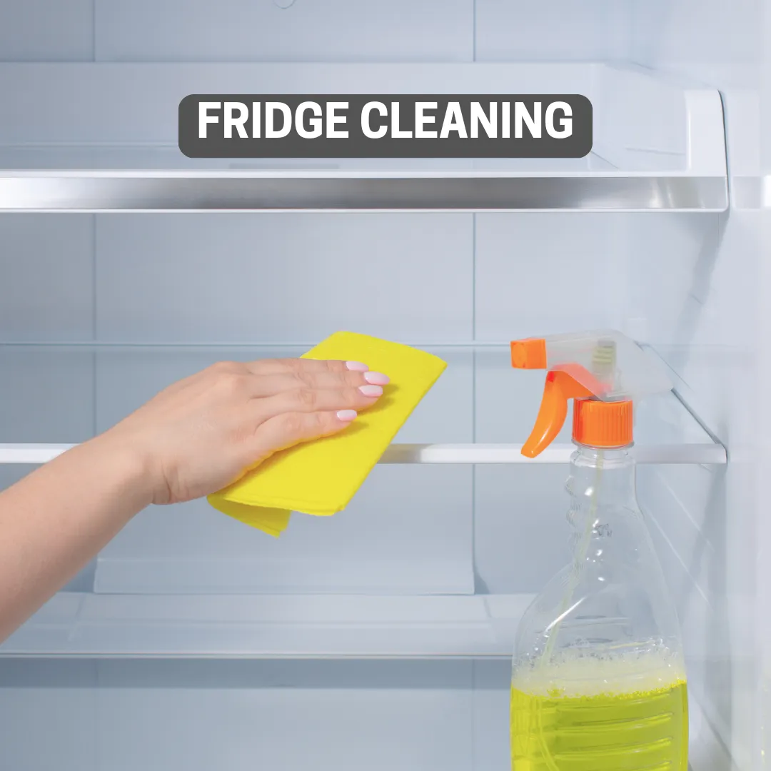 photo of someone cleaning a fridge