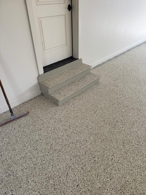 Garage floor in Des Moines finished with random flake epoxy for slip resistance and durability