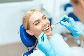 “dentist examining patient with tooth sensitivity”