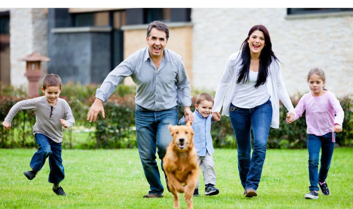 Family running with dog