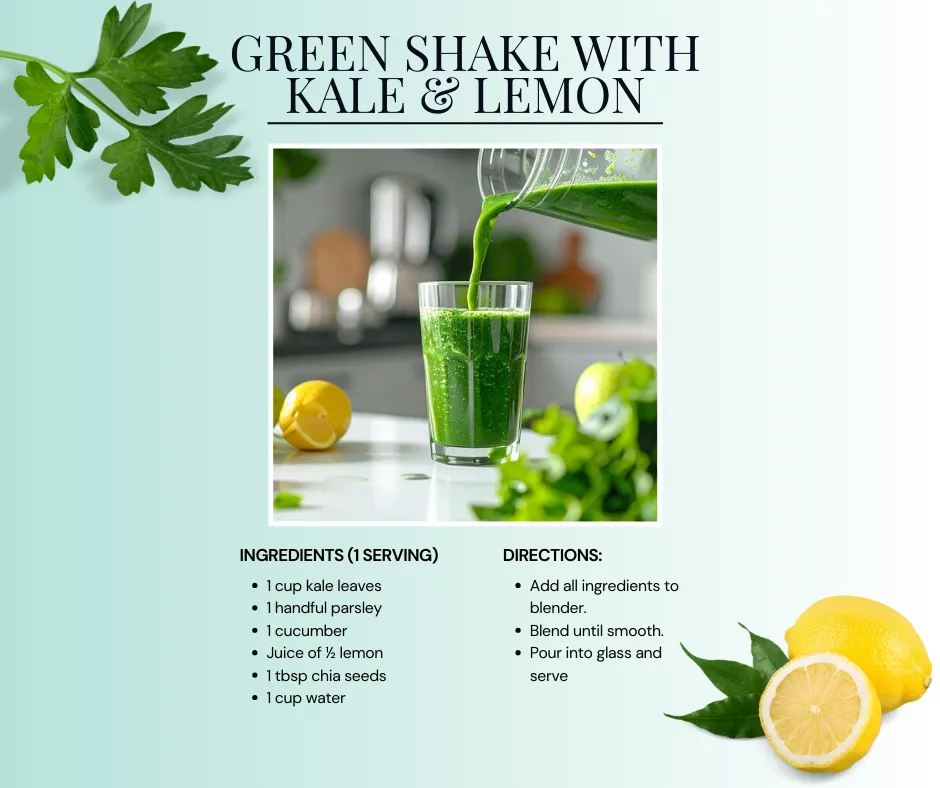 Glass of green shake with kale and lemon surrounded by fresh ingredients.