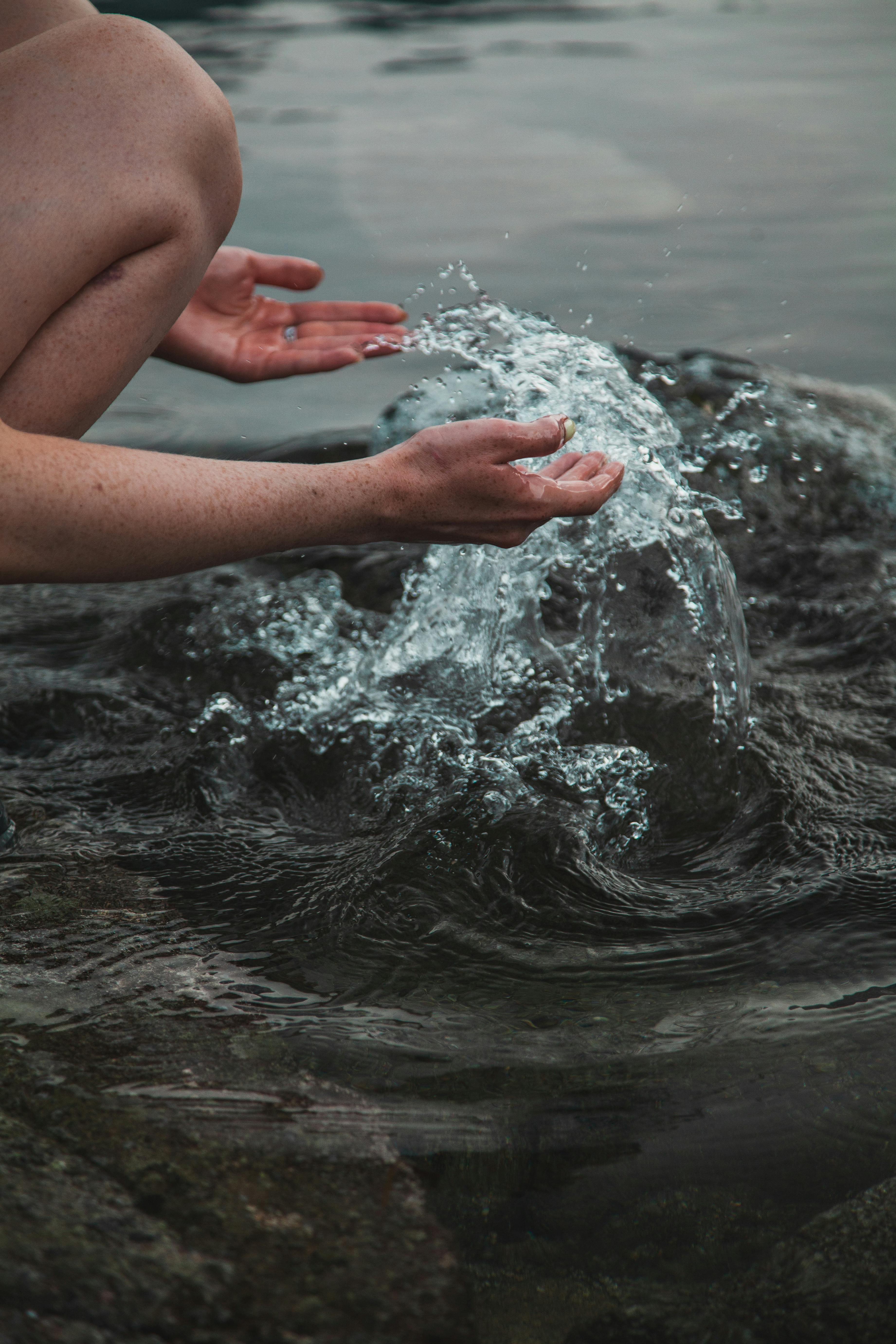 hands in water