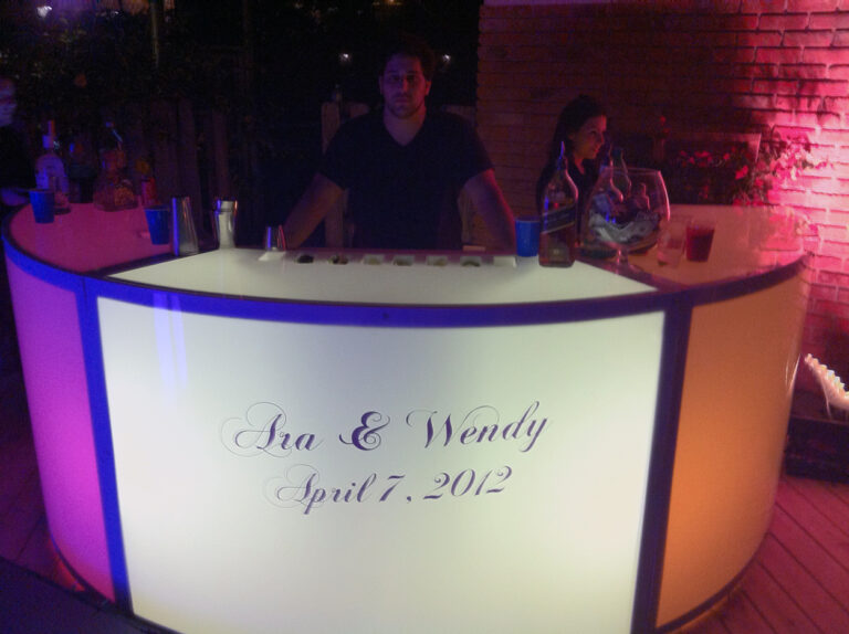 Lighted bar with custom event signage.