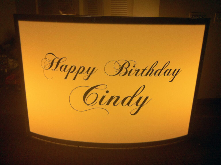 Lighted bar with a “Happy Birthday Cindy” sign.