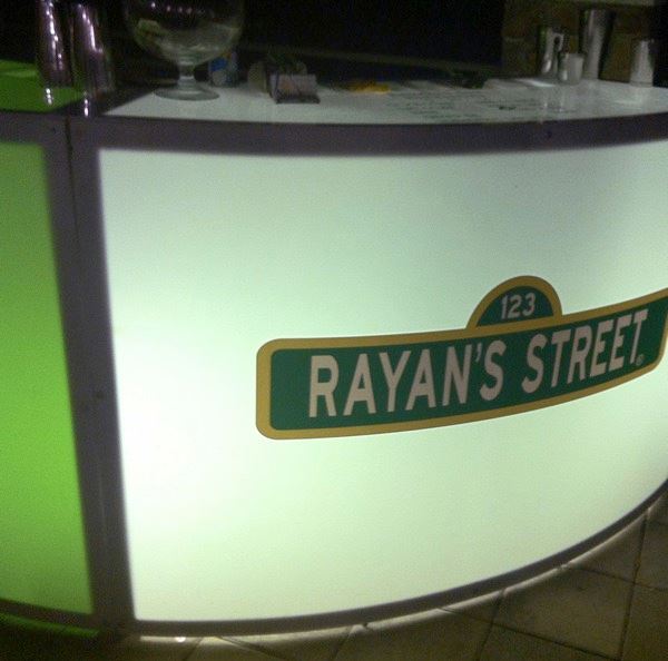 Lighted bar with a custom “Rayan’s Street” sign.