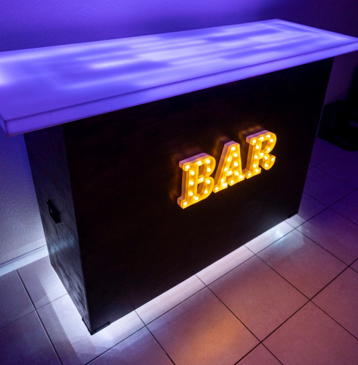 Lighted bar with illuminated BAR sign.