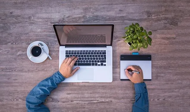 Goal Setting on a notepad and a laptop